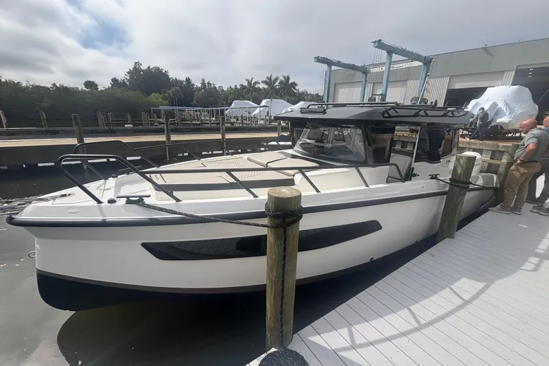 Slide: The Image of 2026 Navan C30 boat docked at marina, featuring sleek design and modern amenities. - 5