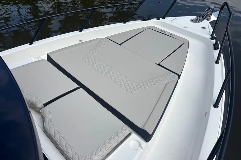 Slide: The Image of 2026 Navan C30 boat with cushioned deck, featuring sleek design and elegant stitching. - 7