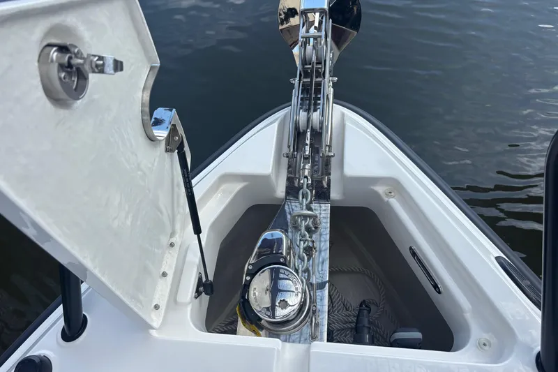 Slide: The Image of Anchor compartment of 2026 Navan C30 boat with open hatch and chain mechanism. - 9