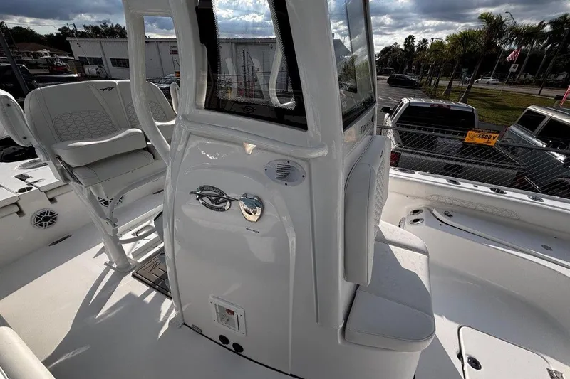 Slide: The Image of 2026 Tidewater 2500 Carolina Bay boat interior with seating and console details. - 25