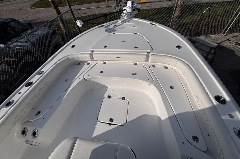 Slide: The Image of 2026 Tidewater 2500 Carolina Bay boat deck with storage compartments and seating. - 27