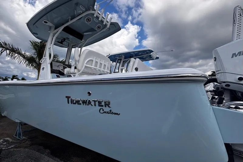 Slide: The Image of 2026 Tidewater 2500 Carolina Bay boat with sleek design under cloudy sky. - 3