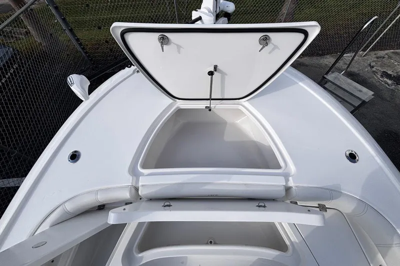 Slide: The Image of 2026 Tidewater 2500 Carolina Bay boat with open storage compartment, showcasing spacious design. - 30