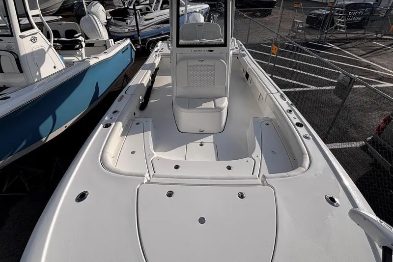 Slide: The Image of 2026 Tidewater 2500 Carolina Bay boat, white interior, docked in a marina. - 35