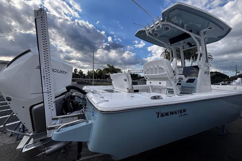 Slide: The Image of 2026 Tidewater 2500 Carolina Bay boat with Mercury engine under cloudy sky. - 7