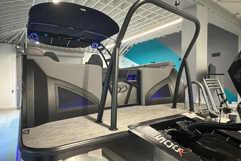 Slide: The Image of 2025 Veranda VX 27 DCRC pontoon boat interior with modern design and blue LED lighting. - 10