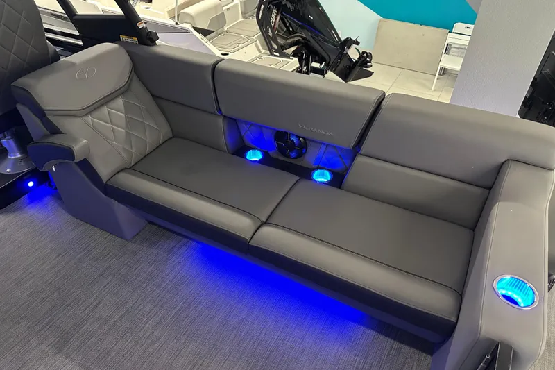 Slide: The Image of Luxurious Veranda VX 27 DCRC 2025 boat interior with gray seating and blue LED lighting. - 15