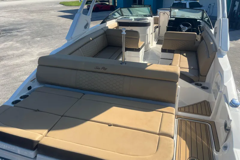 Slide: The Image of 2024 Sea Ray SDX 270 Outboard boat with spacious tan seating and sleek design. - 11