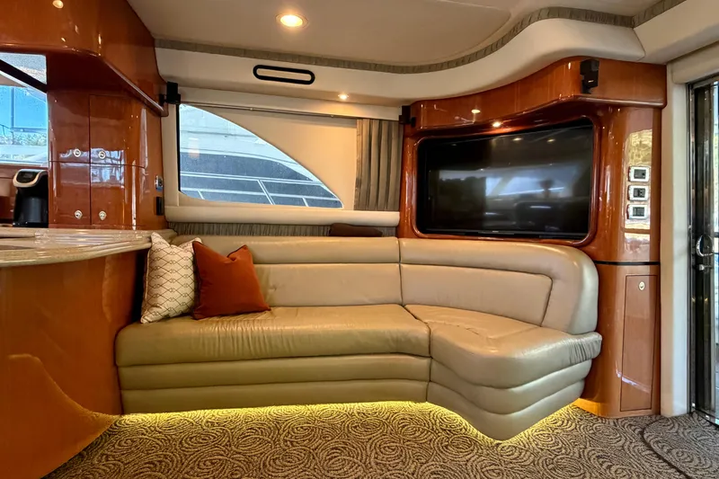 Slide: The Image of Luxurious 2003 Sea Ray 560 Sedan Bridge interior with plush seating and modern amenities. - 11