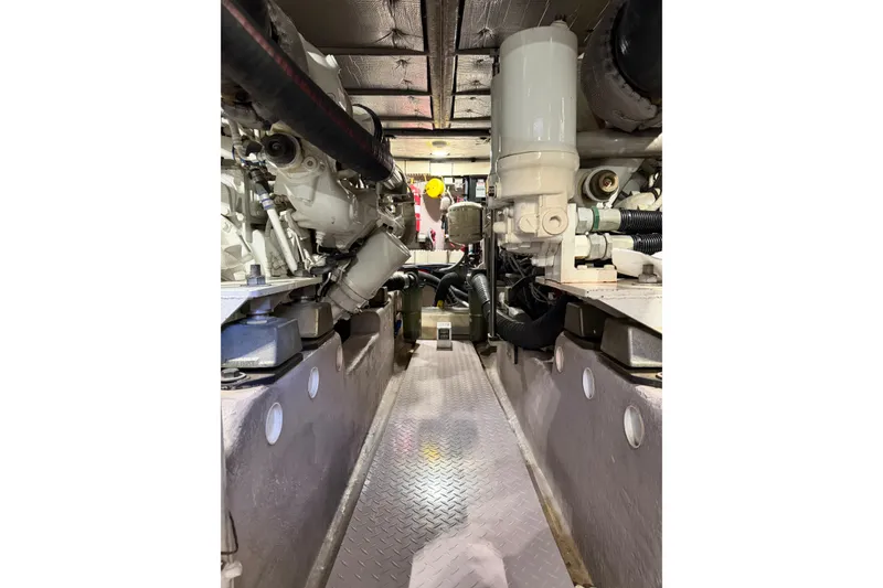 Slide: The Image of Engine room of 2003 Sea Ray 560 Sedan Bridge yacht, showcasing mechanical components. - 20