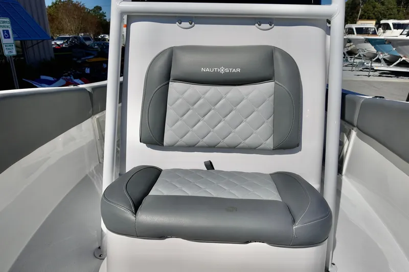 Slide: The Image of 2025 NauticStar 212 Legacy boat seat with gray quilted upholstery. - 11