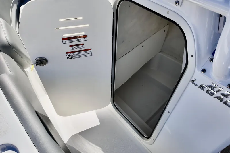 Slide: The Image of Open storage compartment on 2025 NauticStar 212 Legacy boat. - 14