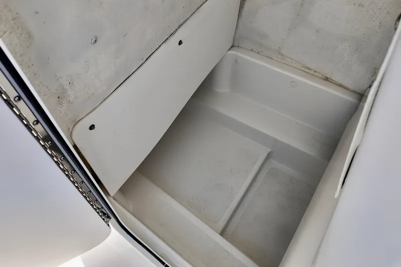 Slide: The Image of Storage compartment of 2025 NauticStar 212 Legacy boat, featuring a clean, spacious interior. - 15