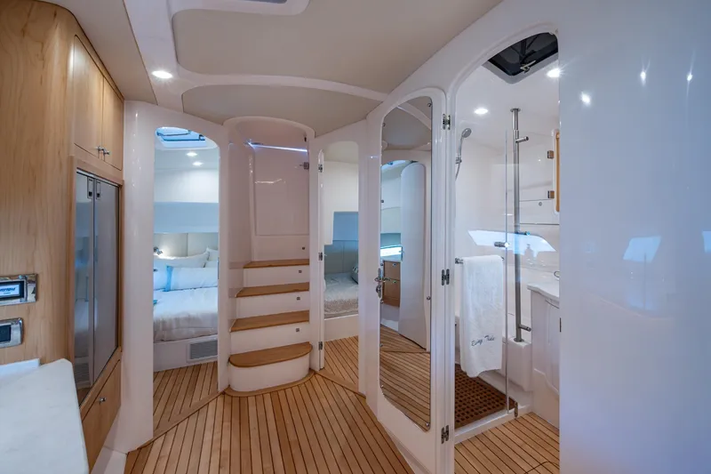 Slide: The Image of Luxurious interior of 2023 Intrepid 477 Evolution yacht with modern design and wooden flooring. - 29