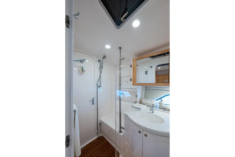 Slide: The Image of Modern bathroom interior of 2023 Intrepid 477 Evolution yacht, featuring shower and vanity. - 31