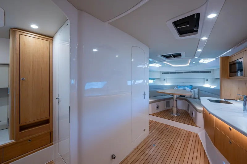 Slide: The Image of Luxurious interior of 2023 Intrepid 477 Evolution yacht with modern design and wooden accents. - 40