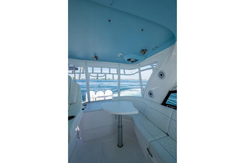Slide: The Image of Interior of 2023 Intrepid 477 Evolution yacht with seating and ocean view. - 69