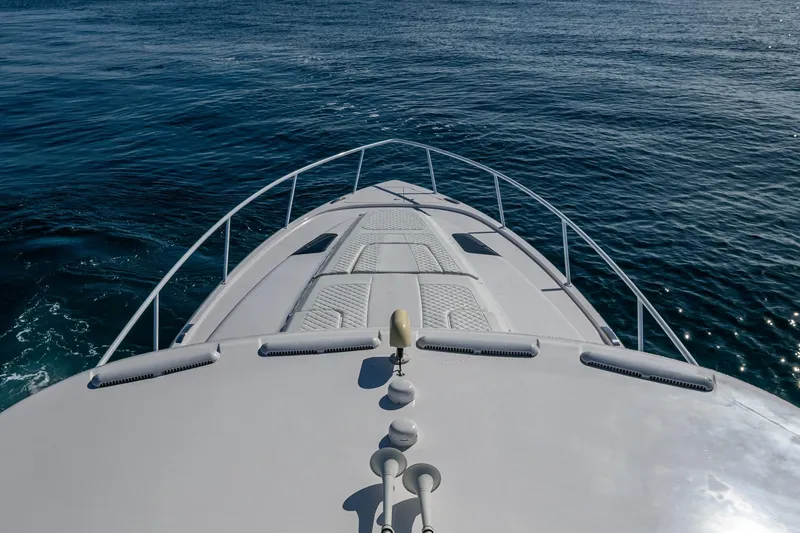 Slide: The Image of Bow view of 2023 Intrepid 477 Evolution yacht on open water. - 94