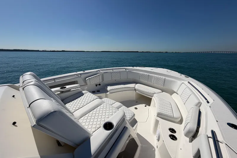 Slide: The Image of 2021 Pursuit S 378 Sport boat with luxurious seating on open water. - 13