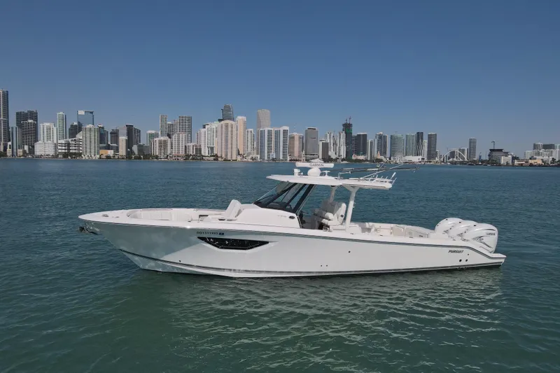 Slide: The Image of 2021 Pursuit S 378 Sport boat on water with city skyline background. - 6