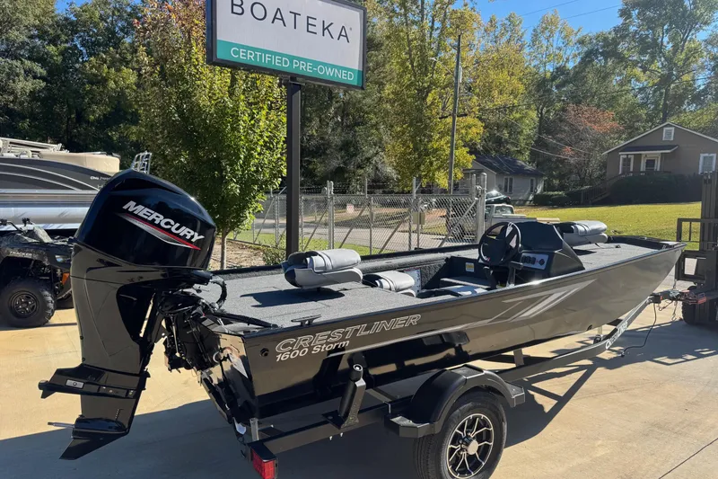 Slide: The Image of 2026 Crestliner 1600 Storm boat with Mercury engine at Boateka, certified pre-owned. - 2