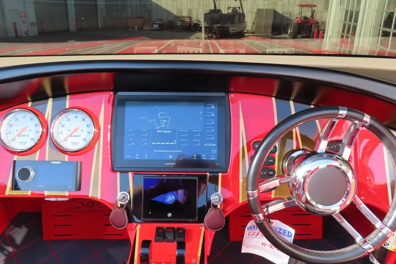 Slide: The Image of Dashboard of a 2010 MTI 36 R/P boat with GPS and control gauges. - 11