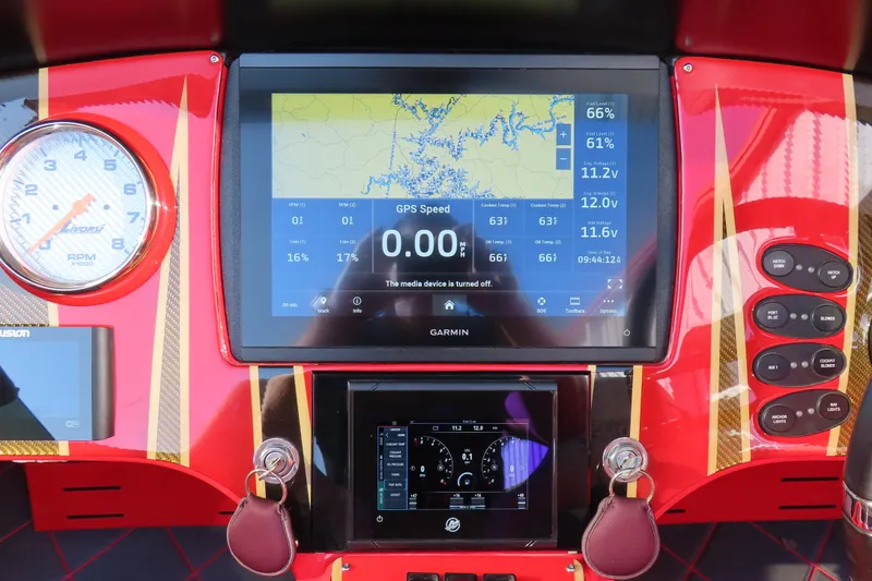 Slide: The Image of Red MTI 36 R/P 2010 boat dashboard with Garmin GPS and Livorsi RPM gauge. - 12