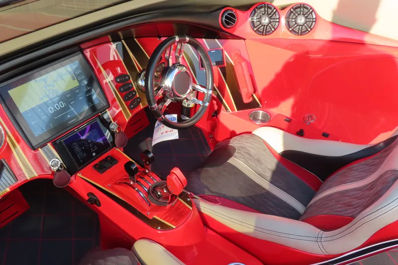 Slide: The Image of Luxurious red interior of 2010 MTI 36 R/P with advanced dashboard and steering wheel. - 14