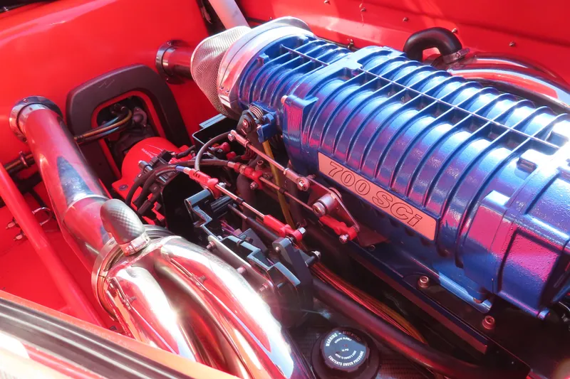 Slide: The Image of High-performance 700 SCi engine in a 2010 MTI 36 R/P boat, showcasing vibrant components. - 17