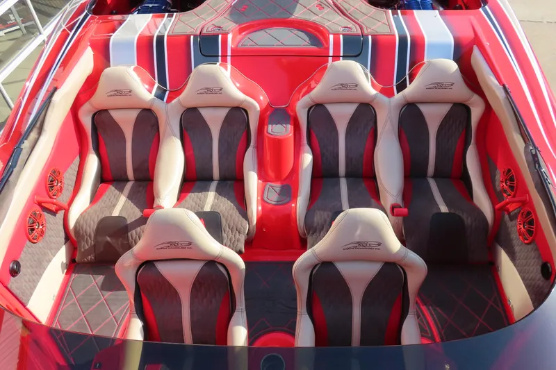 Slide: The Image of Interior of 2010 MTI 36 R/P boat with red and gray seating. - 19