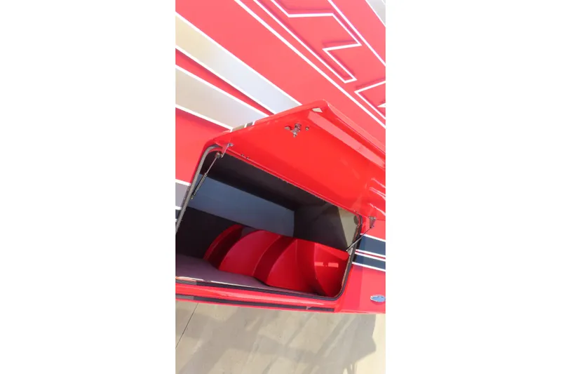 Slide: The Image of Red MTI 36 R/P 2010 boat with open storage compartment, showcasing sleek design. - 20