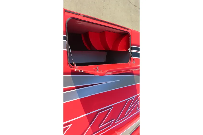 Slide: The Image of Red MTI 36 R/P 2010 boat with open hatch and sleek design. - 22