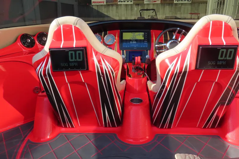 Slide: The Image of Red interior of 2010 MTI 36 R/P boat with digital displays and steering wheel. - 24