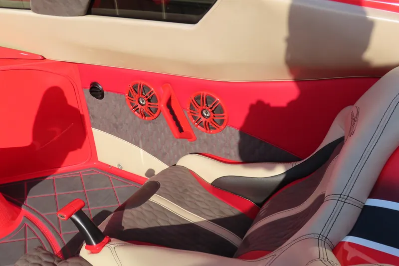 Slide: The Image of Red and beige interior of 2010 MTI 36 R/P boat with stylish seating and speakers. - 25