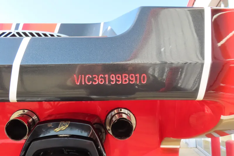 Slide: The Image of 2010 MTI 36 R/P boat with red and black hull, visible serial number. - 26