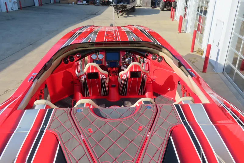 Slide: The Image of Red MTI 36 R/P 2010 speedboat with sleek interior design and advanced dashboard controls. - 8