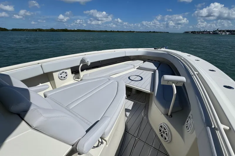 Slide: The Image of 2017 HCB 42 Siesta boat interior with luxurious seating and ocean view. - 13