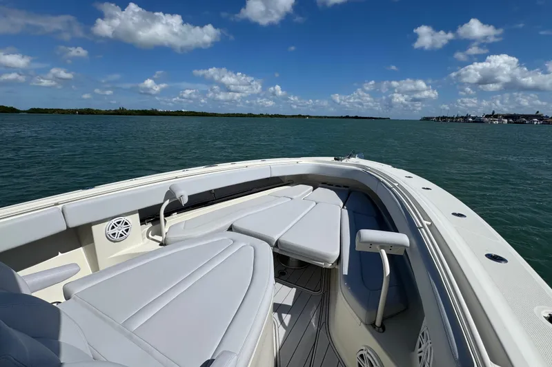 Slide: The Image of 2017 HCB 42 Siesta boat on calm water under a clear blue sky. - 15