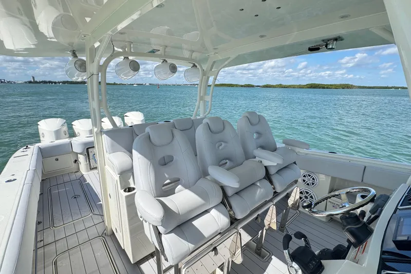 Slide: The Image of 2017 HCB 42 Siesta boat interior with luxurious seating and ocean view. - 17