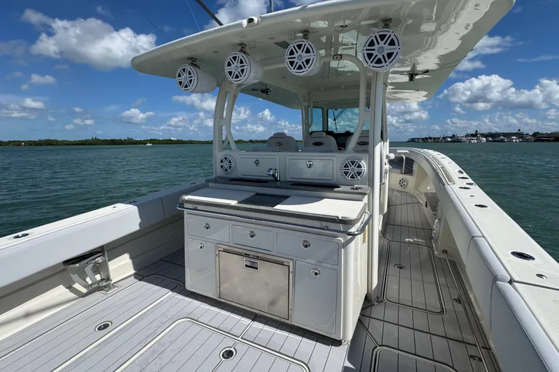 Slide: The Image of 2017 HCB 42 Siesta boat with spacious deck and modern amenities on the water. - 21