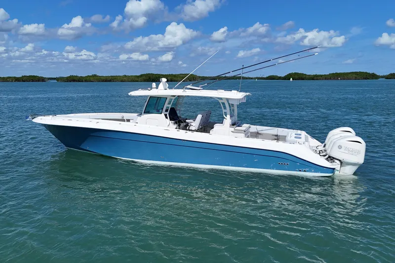 Slide: The Image of 2017 HCB 42 Siesta boat on calm blue water under a clear sky. - 3