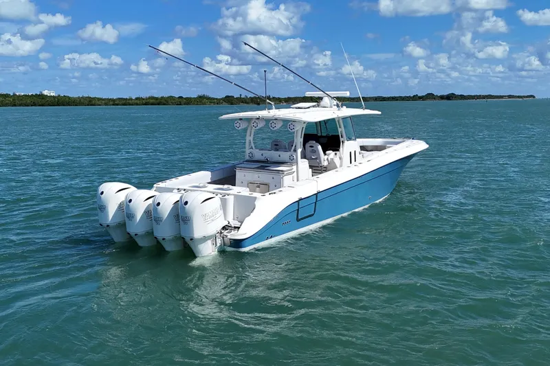 Slide: The Image of 2017 HCB 42 Siesta boat with four Yamaha engines on blue water. - 6