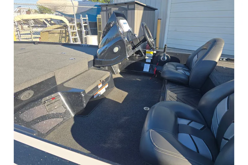 Slide: The Image of 2018 Nitro Z17 boat interior with steering wheel and seating. - 10