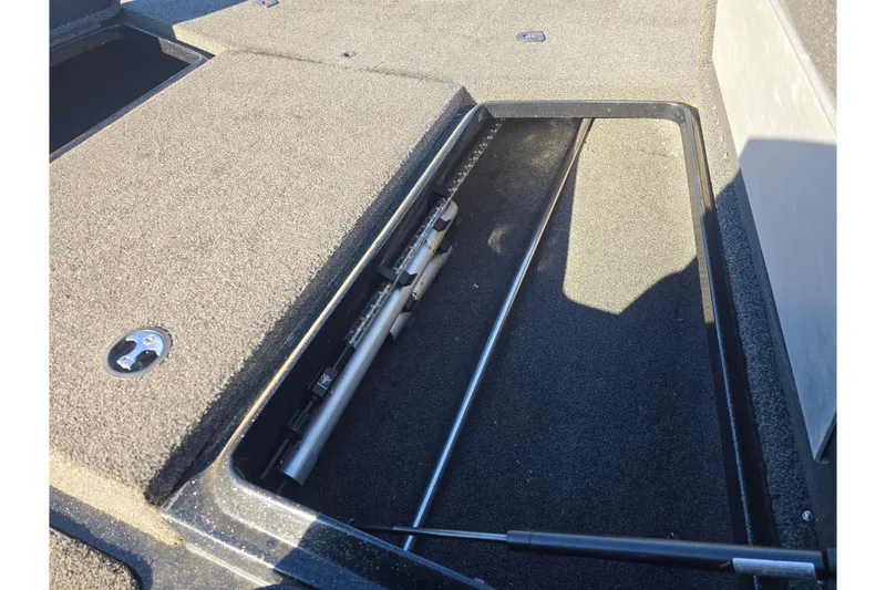 Slide: The Image of 2018 Nitro Z17 boat storage compartment with open hatch and hydraulic lift. - 11