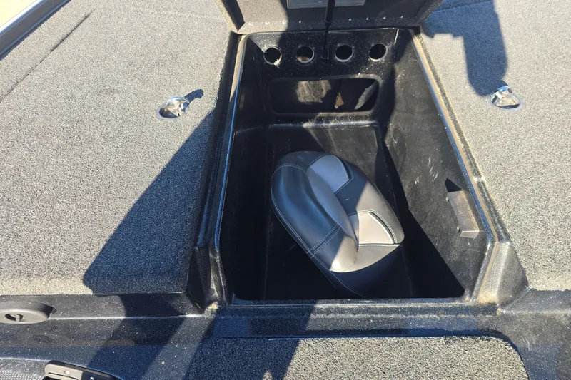 Slide: The Image of Open storage compartment in 2018 Nitro Z17 boat with seat cushion inside. - 13
