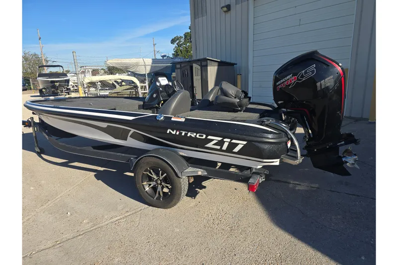 Slide: The Image of 2018 Nitro Z17 boat with Mercury Pro XS engine, parked outdoors. - 3