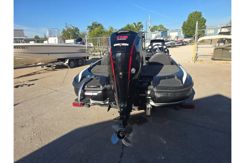 Slide: The Image of 2018 Nitro Z17 boat with Mercury engine, parked on a trailer in a lot. - 4