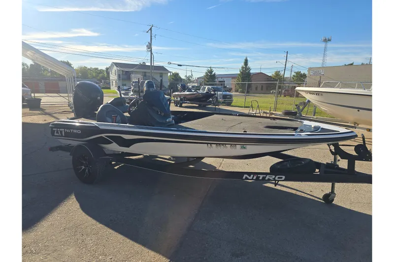 Slide: The Image of 2018 Nitro Z17 boat on trailer in outdoor setting. - 7