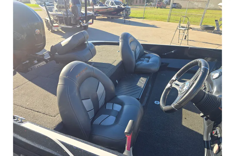 Slide: The Image of 2018 Nitro Z17 boat interior with steering wheel and cushioned seats. - 8