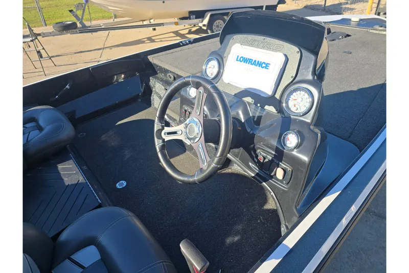 Slide: The Image of 2018 Nitro Z17 boat dashboard with steering wheel and Lowrance display. - 9